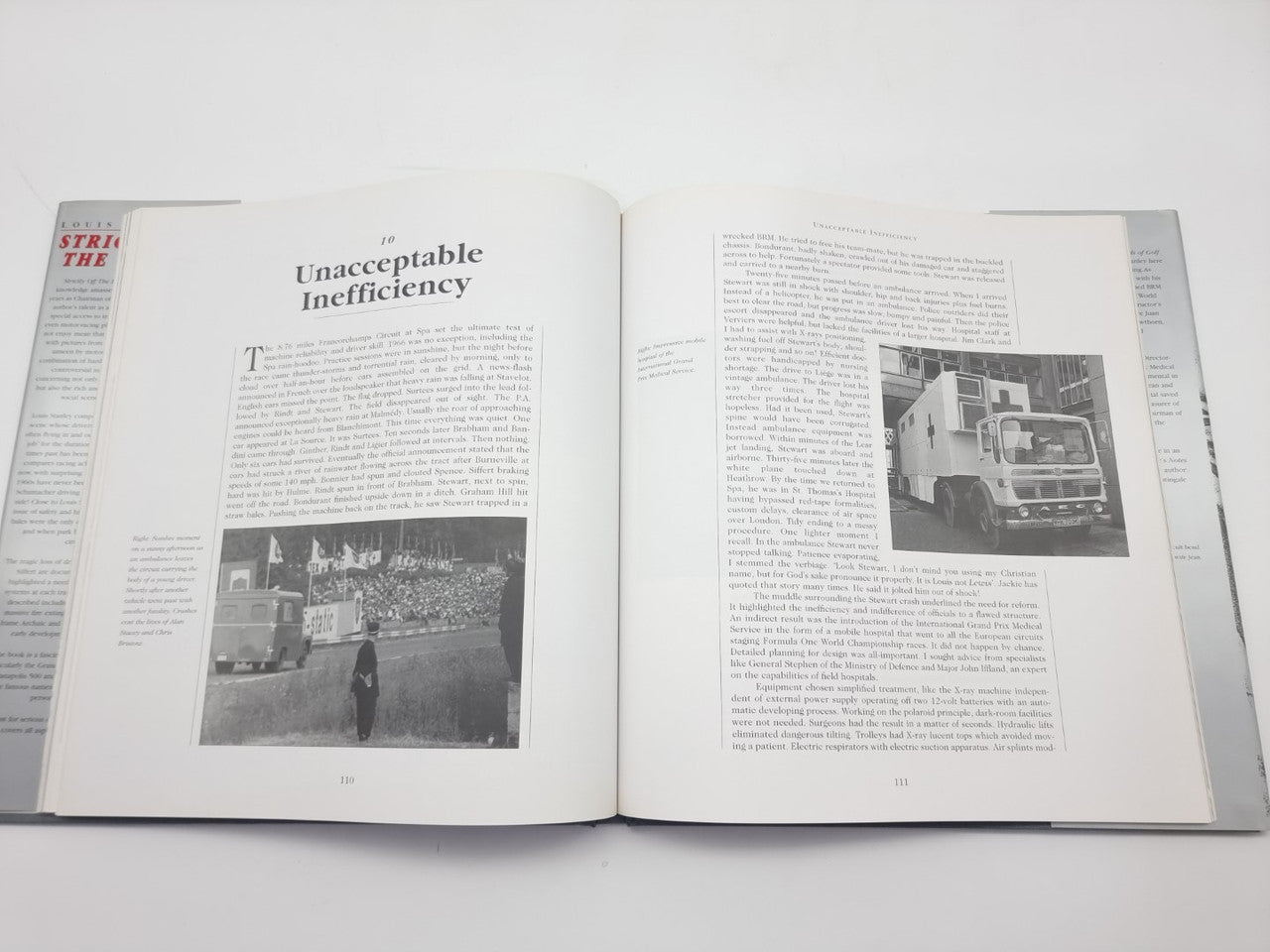 Open book with large headline, grayscale photo, and printed article text