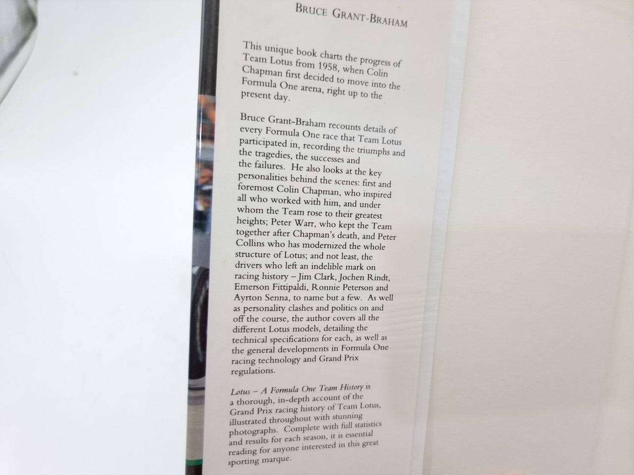 Book page with author name at top and dense paragraphs of text