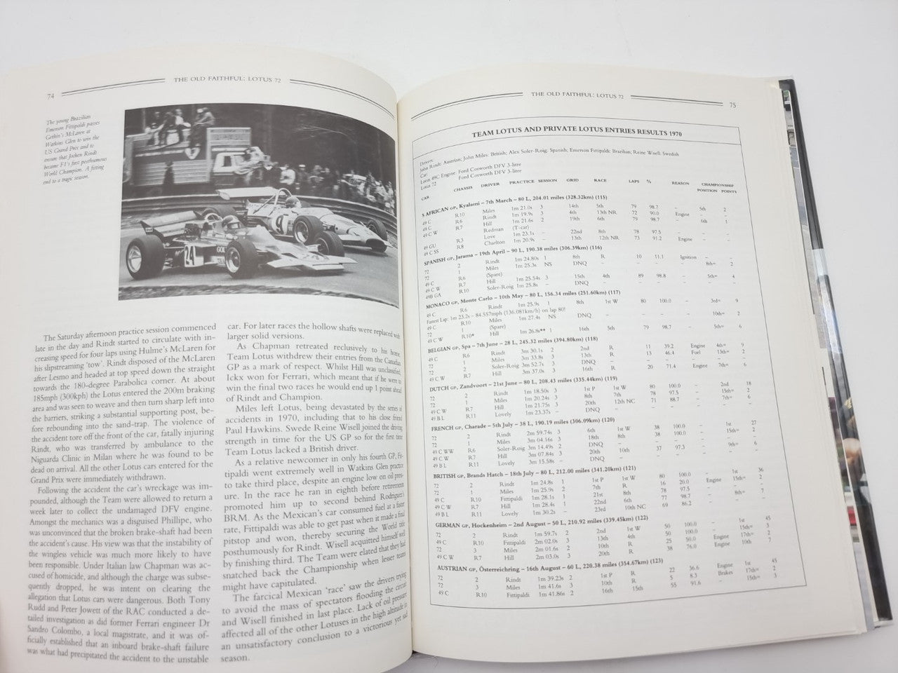 Open book spread with race car photo and a detailed table of numbers