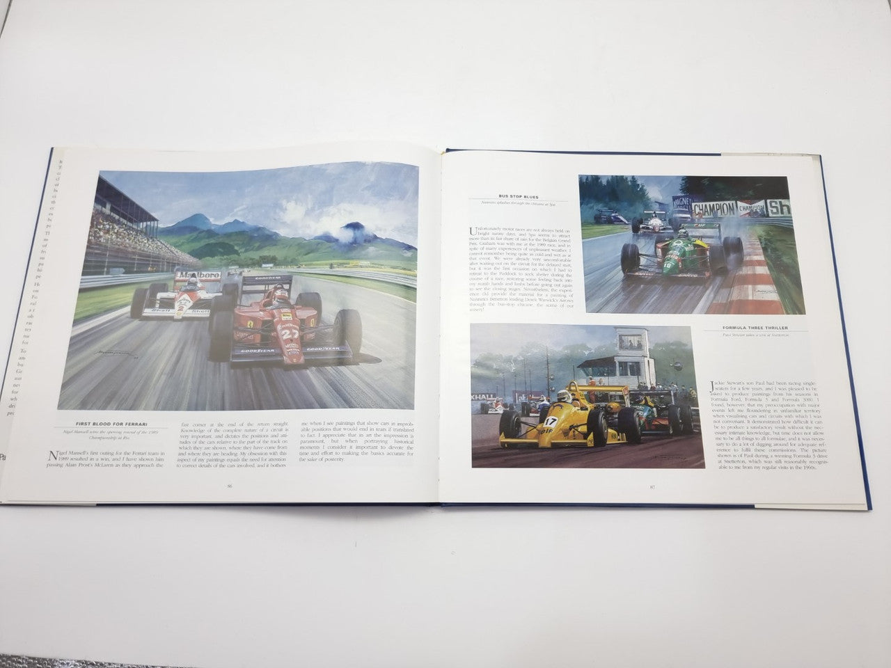 Open motorsport art book spread with color images of formula cars on track