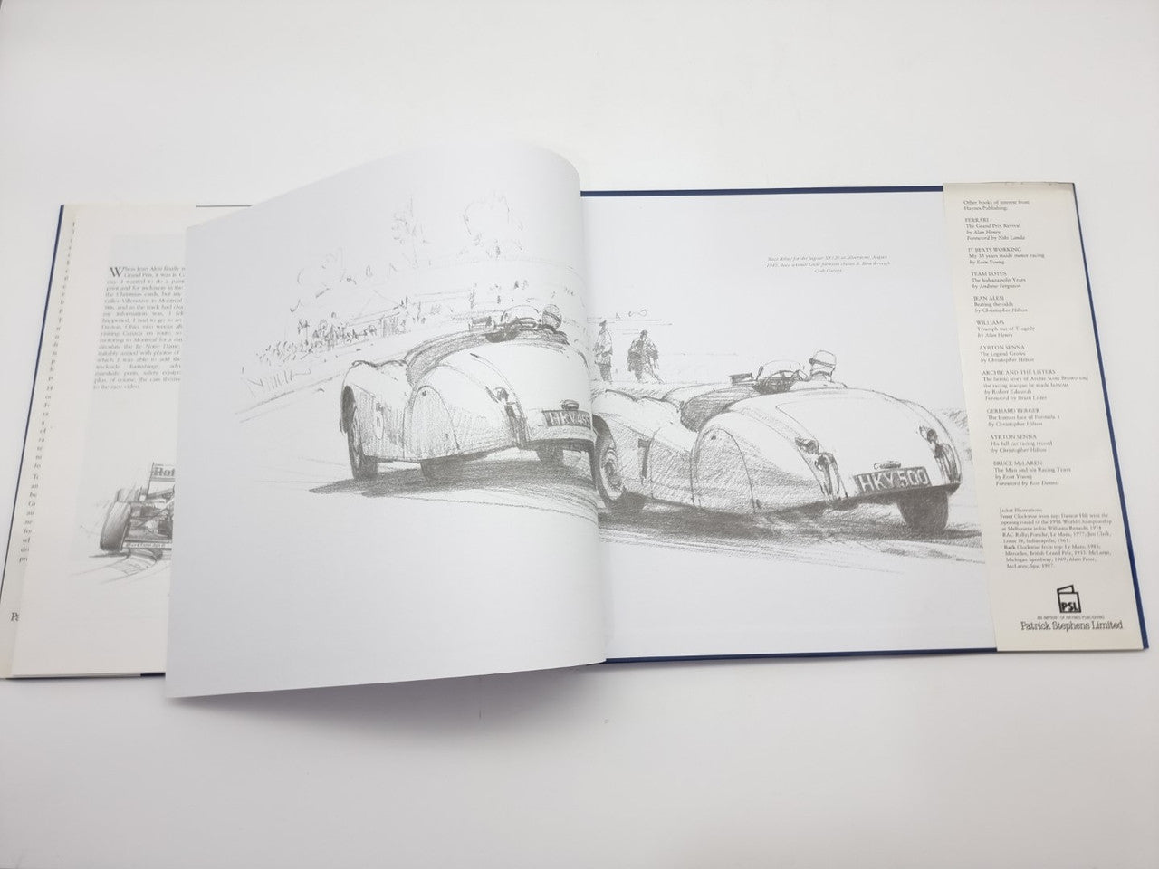 Signed 1996 motorsport art book, open pages with black-and-white racing car sketches