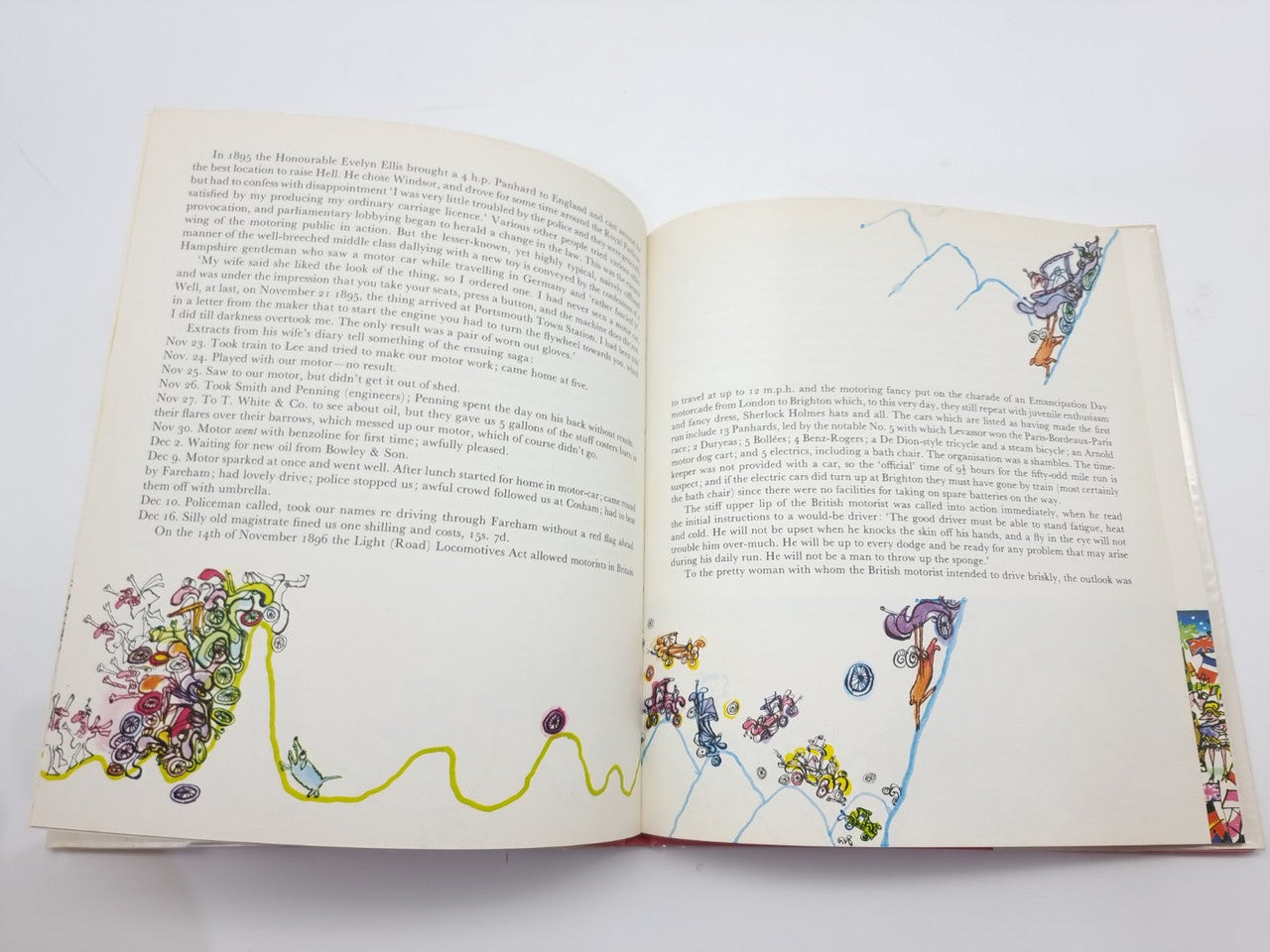 Open vintage illustrated book with detailed line art and text blocks on both pages.