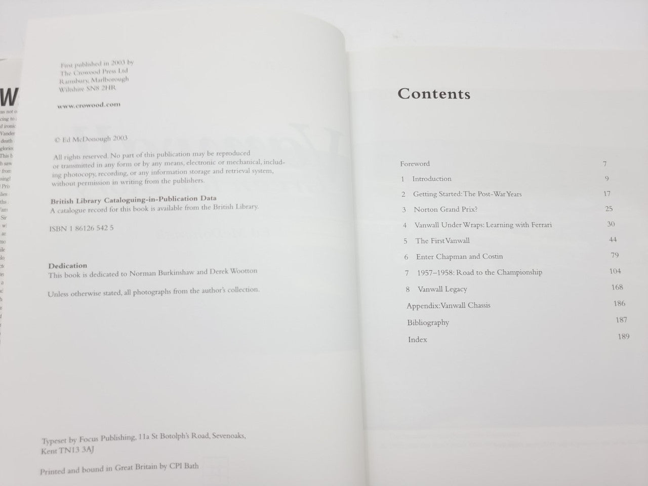 Open motorsport book showing contents list and small paragraph text on both pages