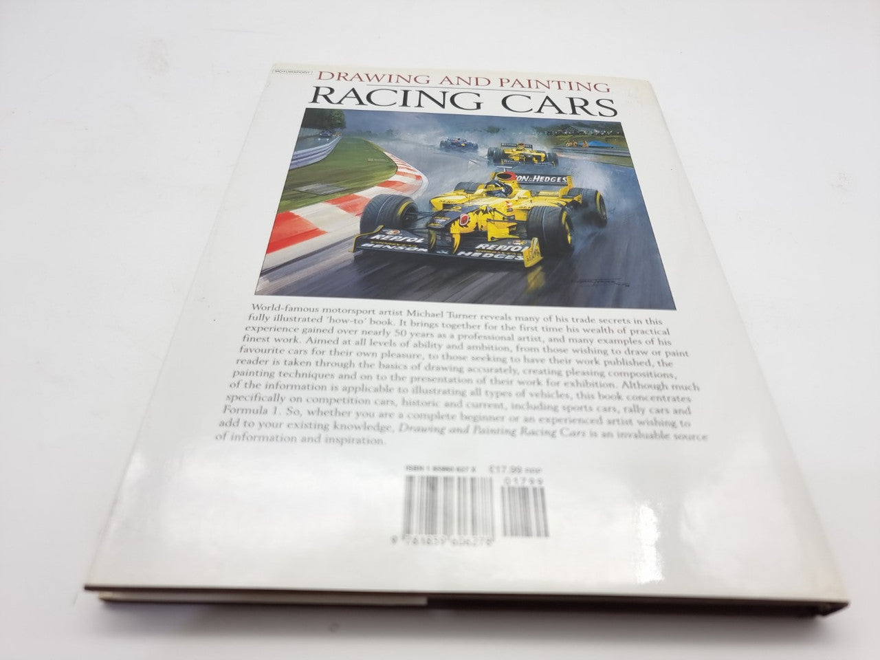 Racing cars drawing and painting book back cover with track photo and barcode strip