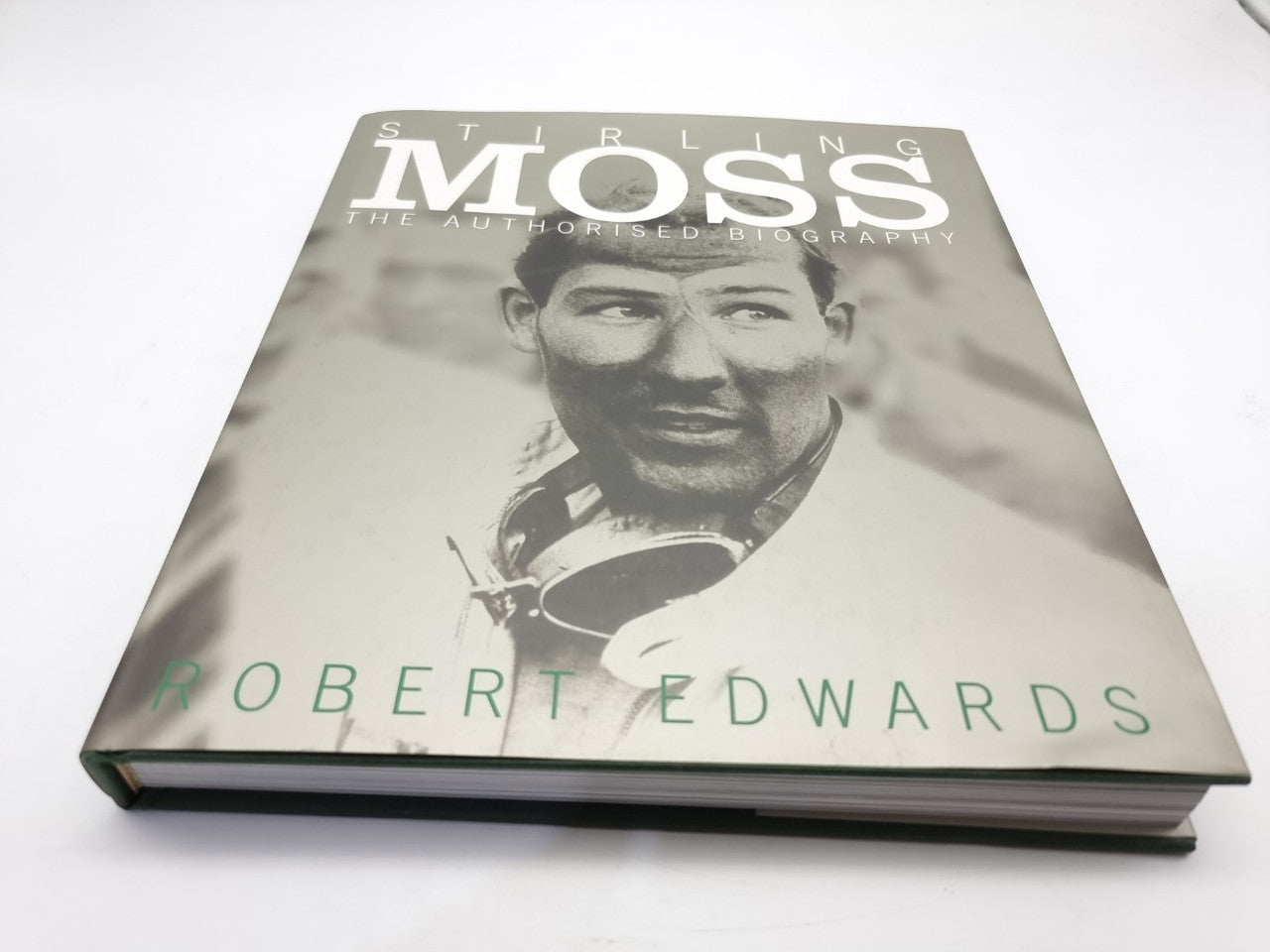 Stirling Moss biography book with gray cover and portrait of the driver