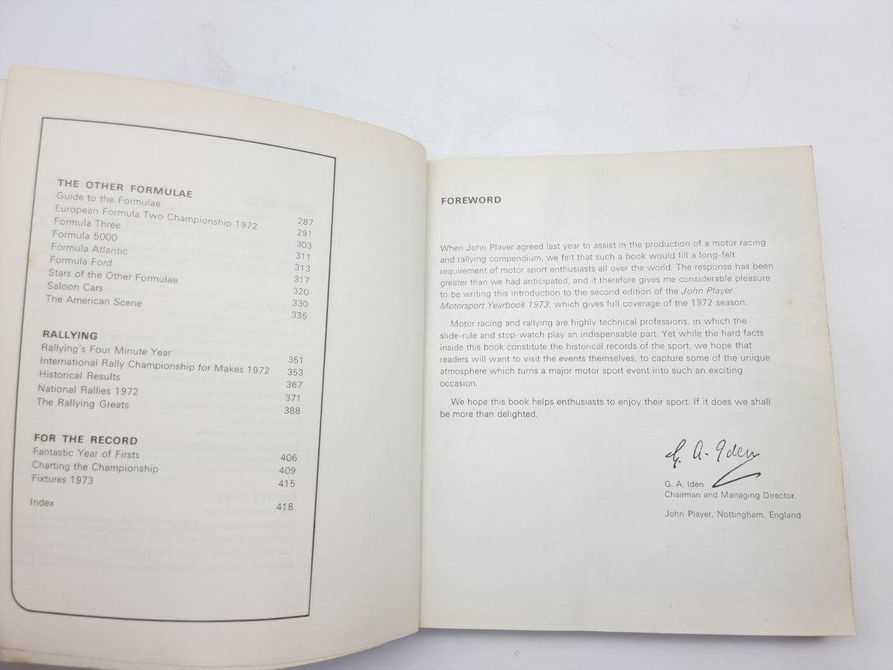1973 motorsport yearbook open, left index-style list and right foreword signature.