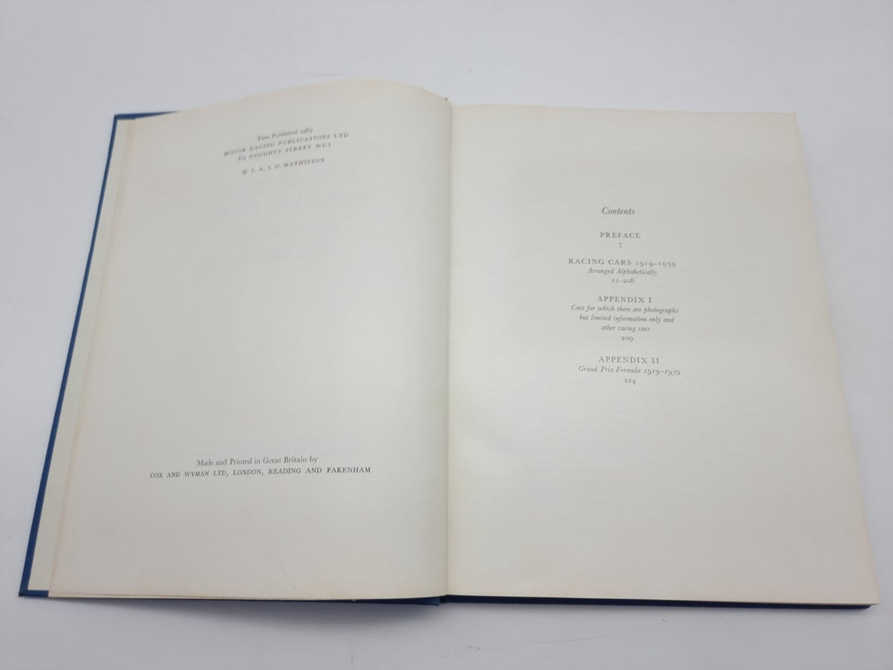 Open book spread with printed text and centered heading on right page