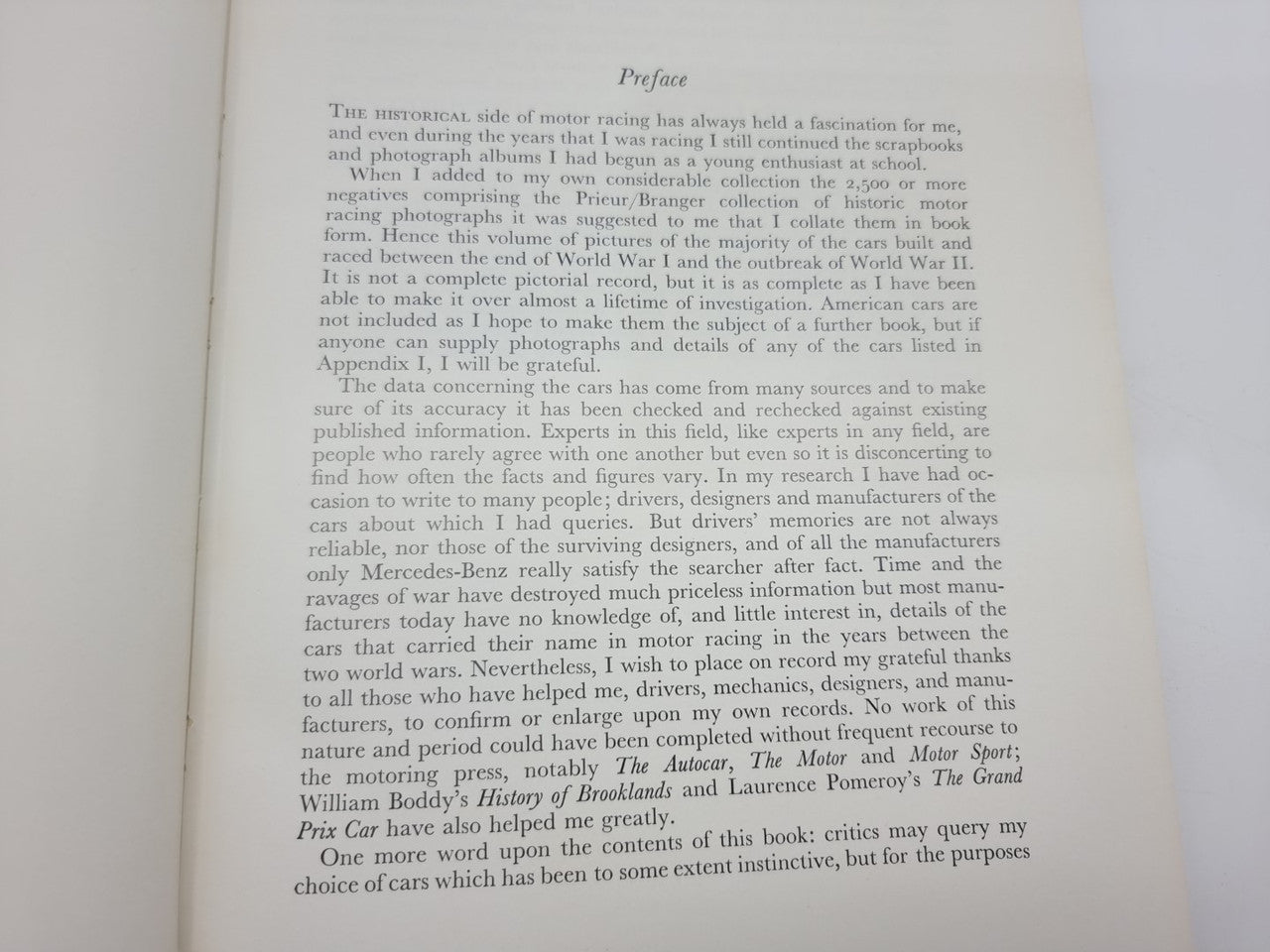 Open book page with dense paragraph text and a top section heading