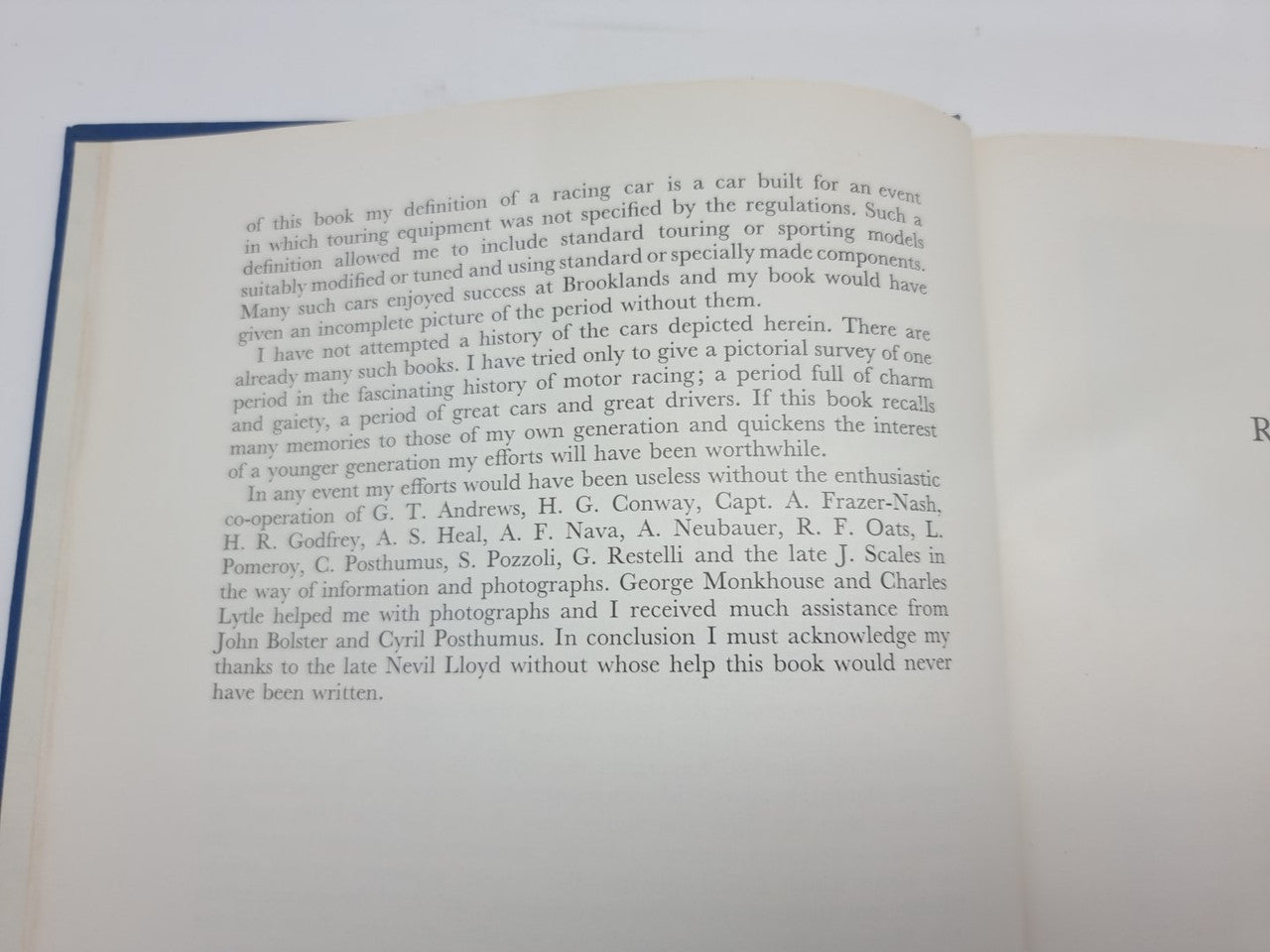 Open book page with paragraph text and a list of names in fine print