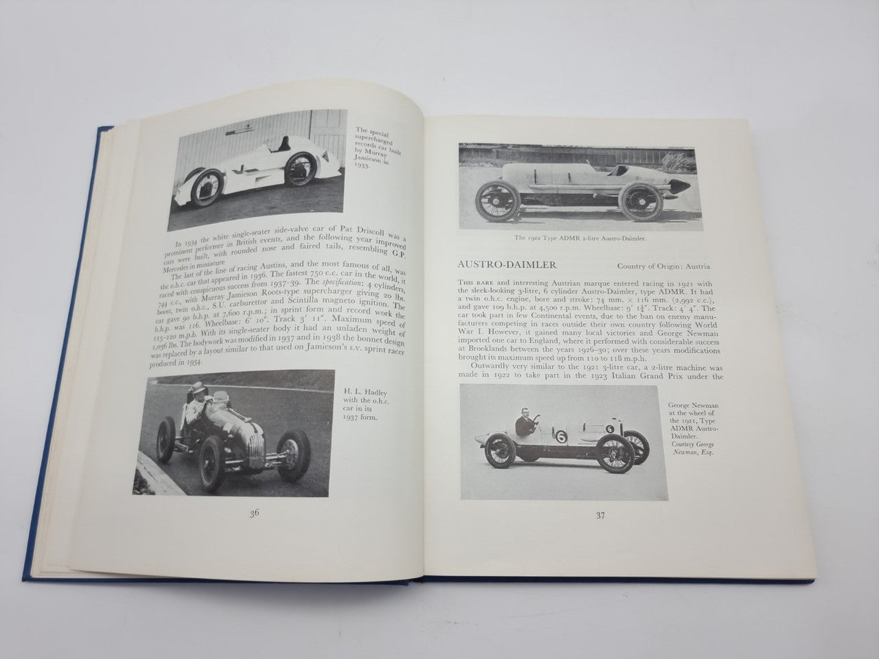 Open book spread with black-and-white race car photos and accompanying text