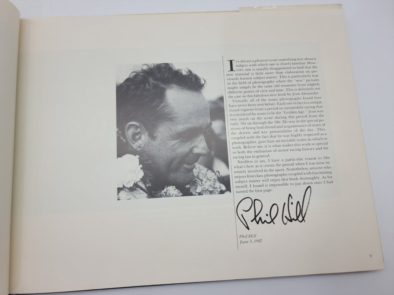Open book page with portrait photo and handwritten signature
