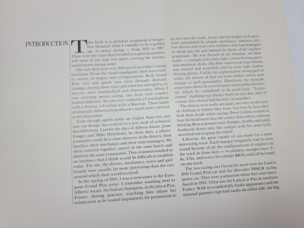 Open book spread with text and photo column pages