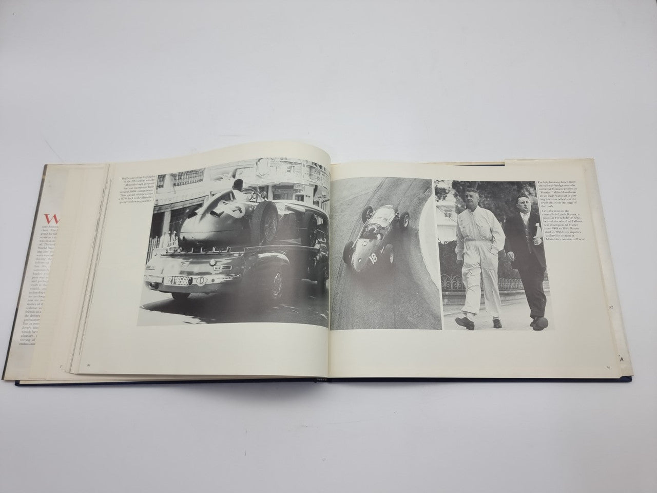 Open book spread with close-up car photo and two men standing