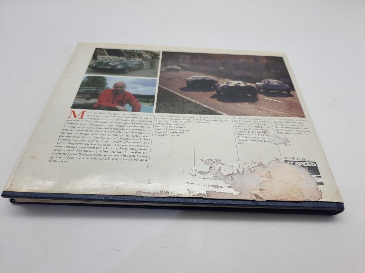 Signed hardcover book open to vintage photos and text
