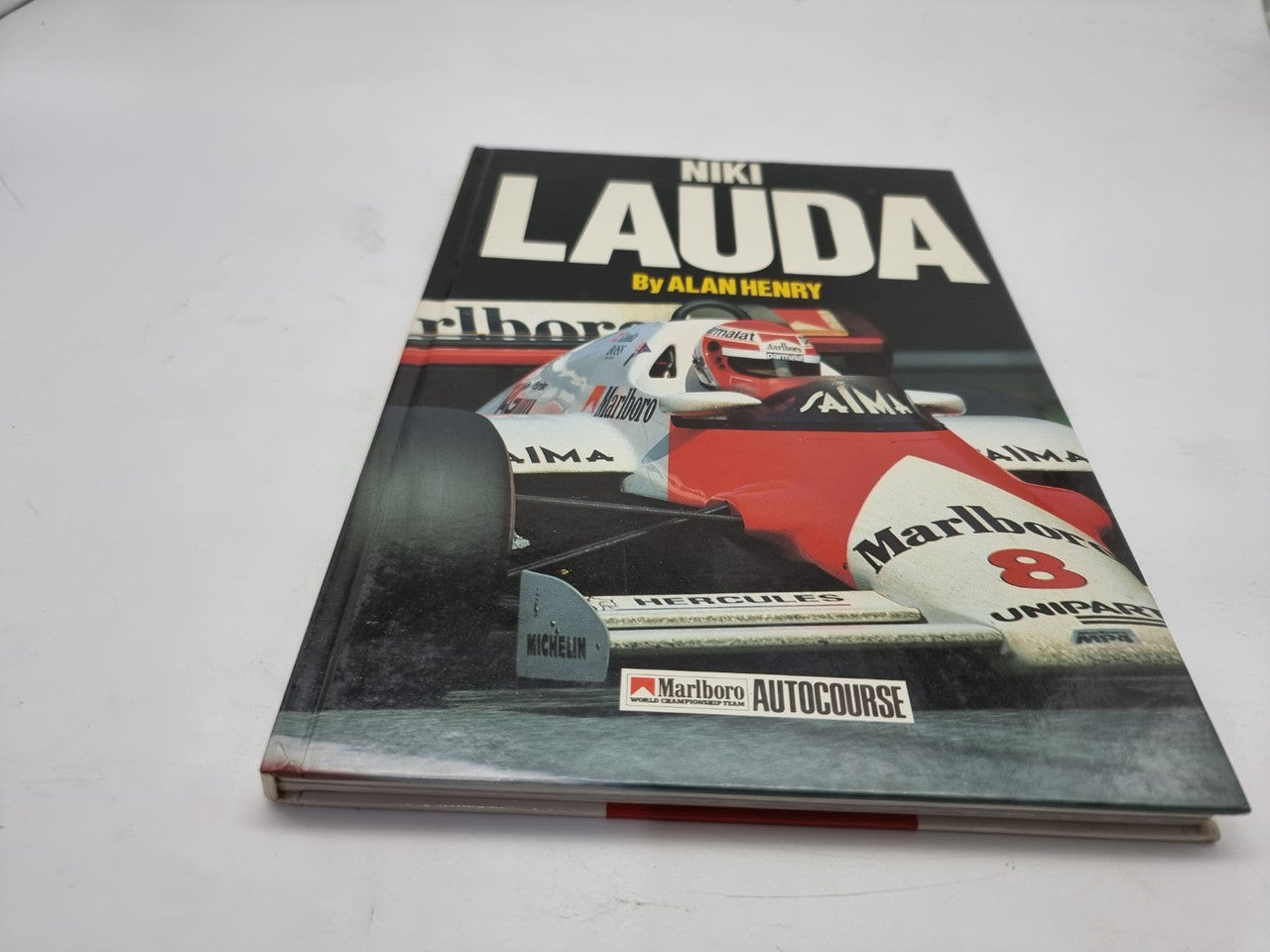 Motorsport book with Niki Lauda racing car photo on glossy cover
