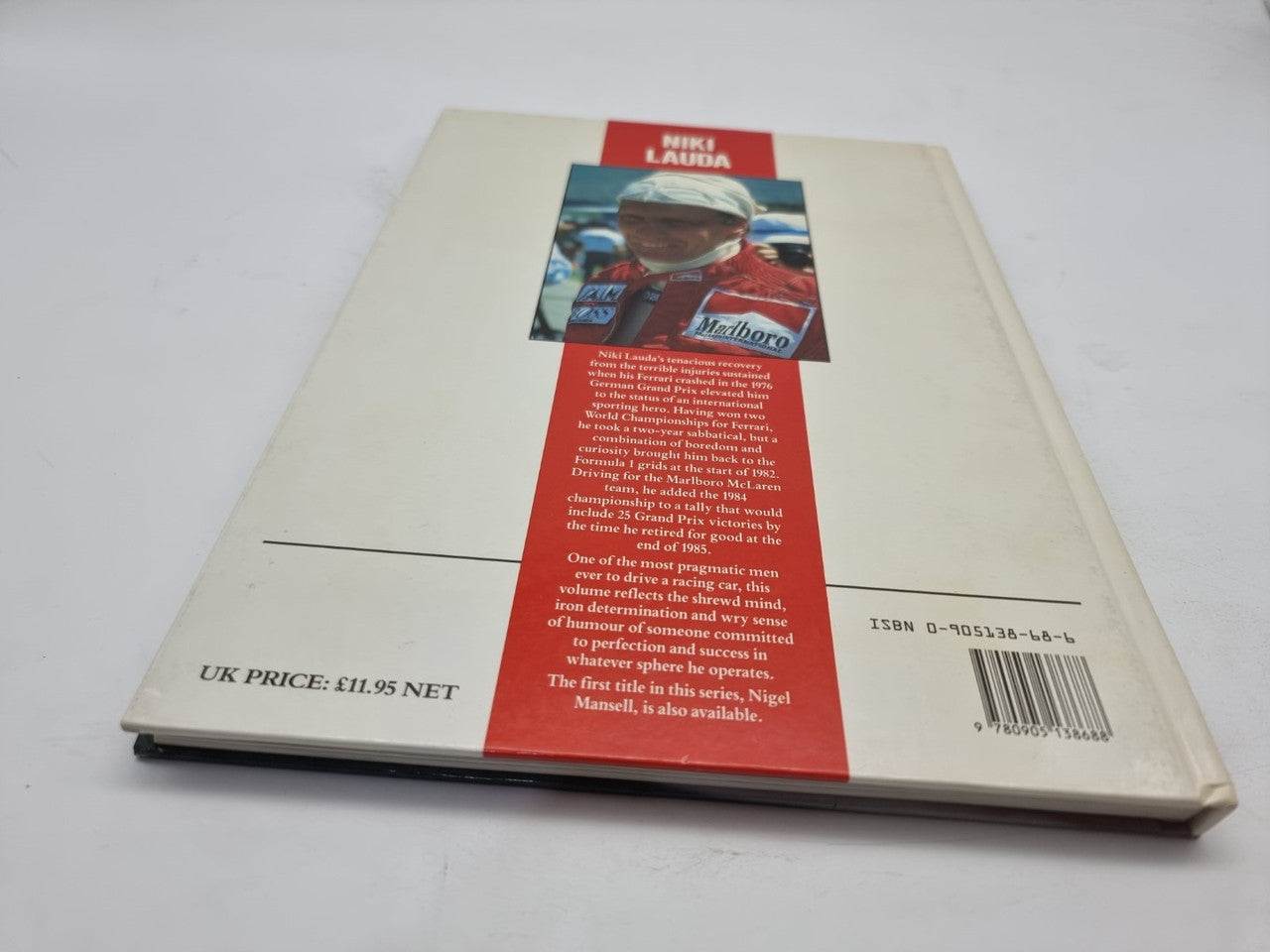 Motorsport book back cover with portrait photo, text panel, and barcode
