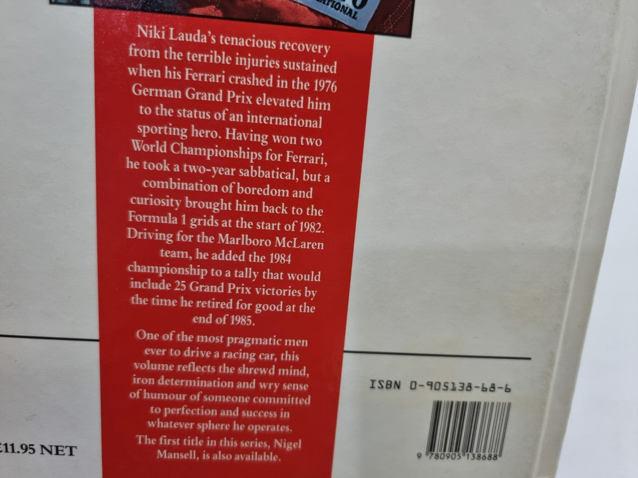 Motorsport book page showing red text block and ISBN barcode