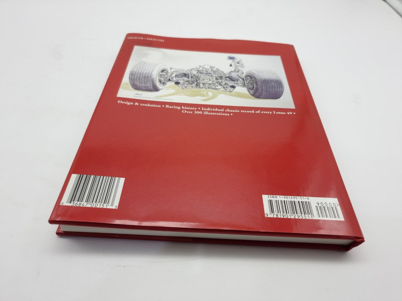 Red back cover hardcover with technical car photo and barcodes