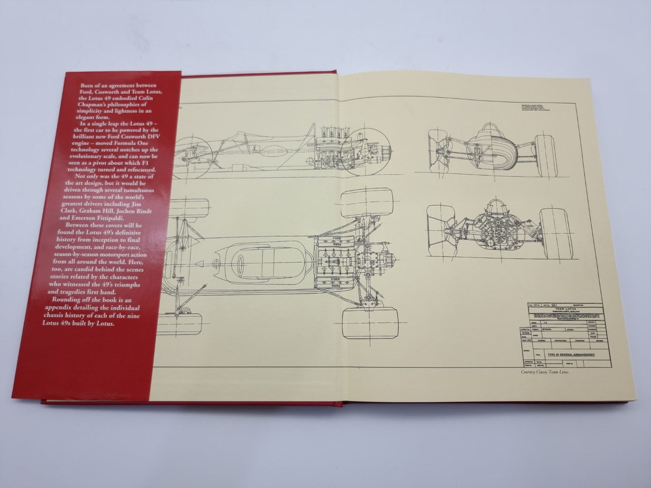 Open book showing engineering line drawings on white pages, hardcover binding