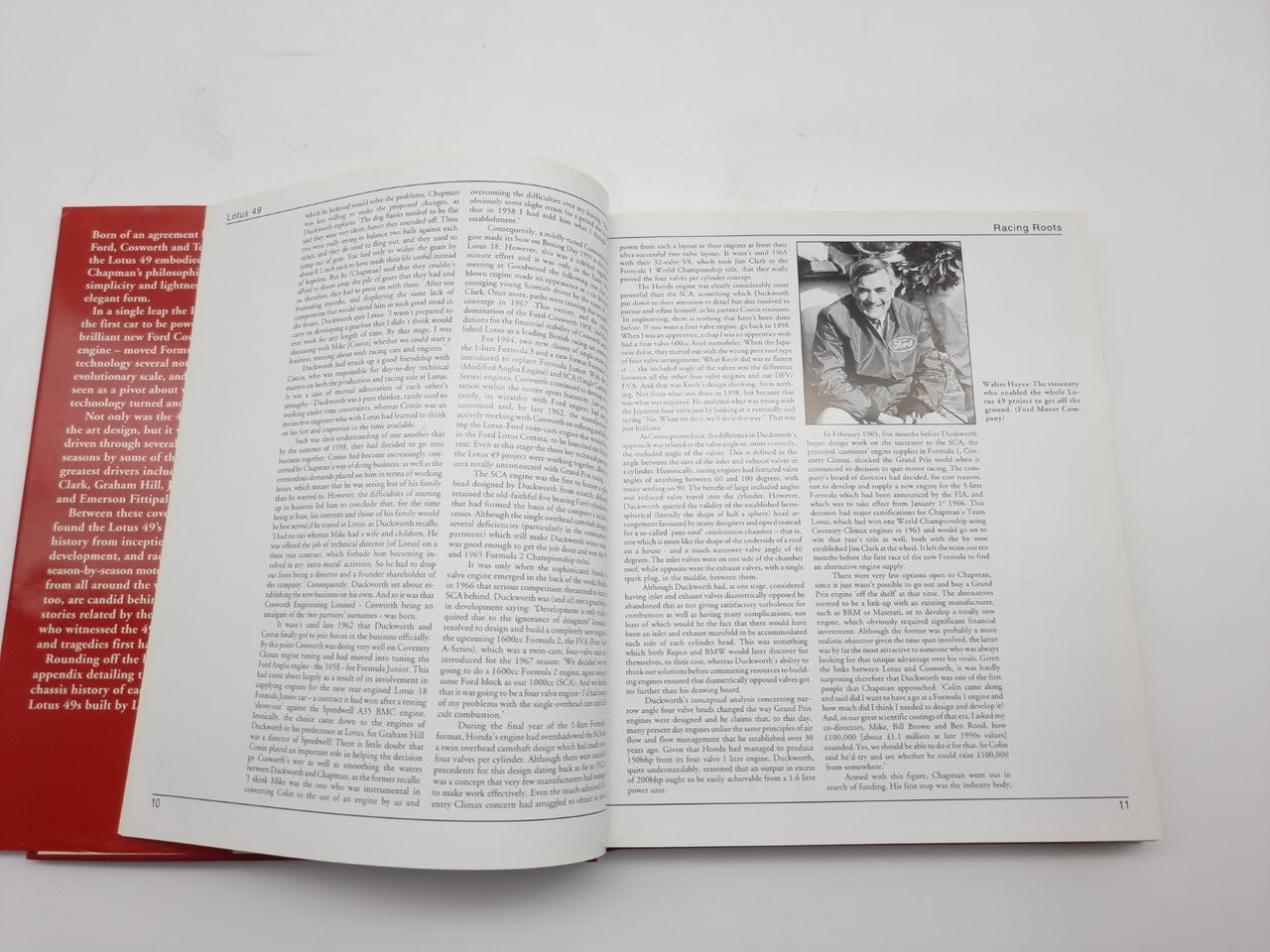 Open book page with dense text and small portrait photo on white pages