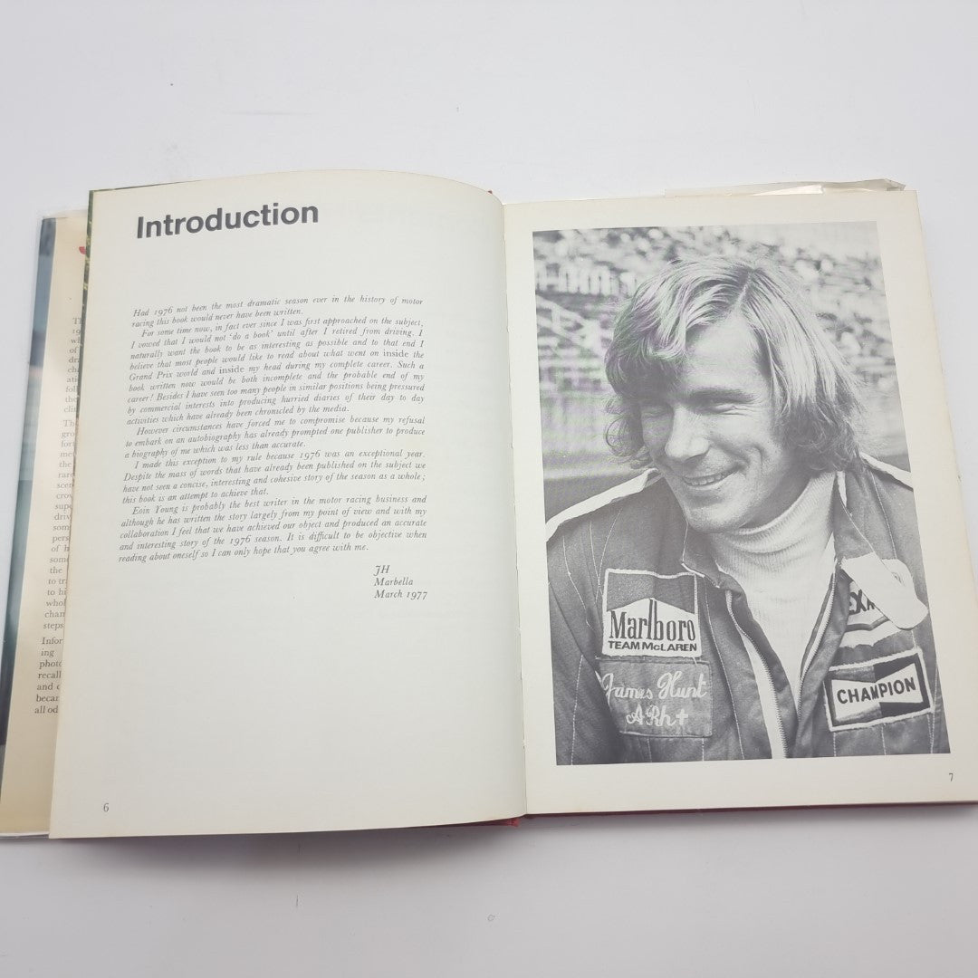 Racing memoir book open to Introduction page with portrait photo on right