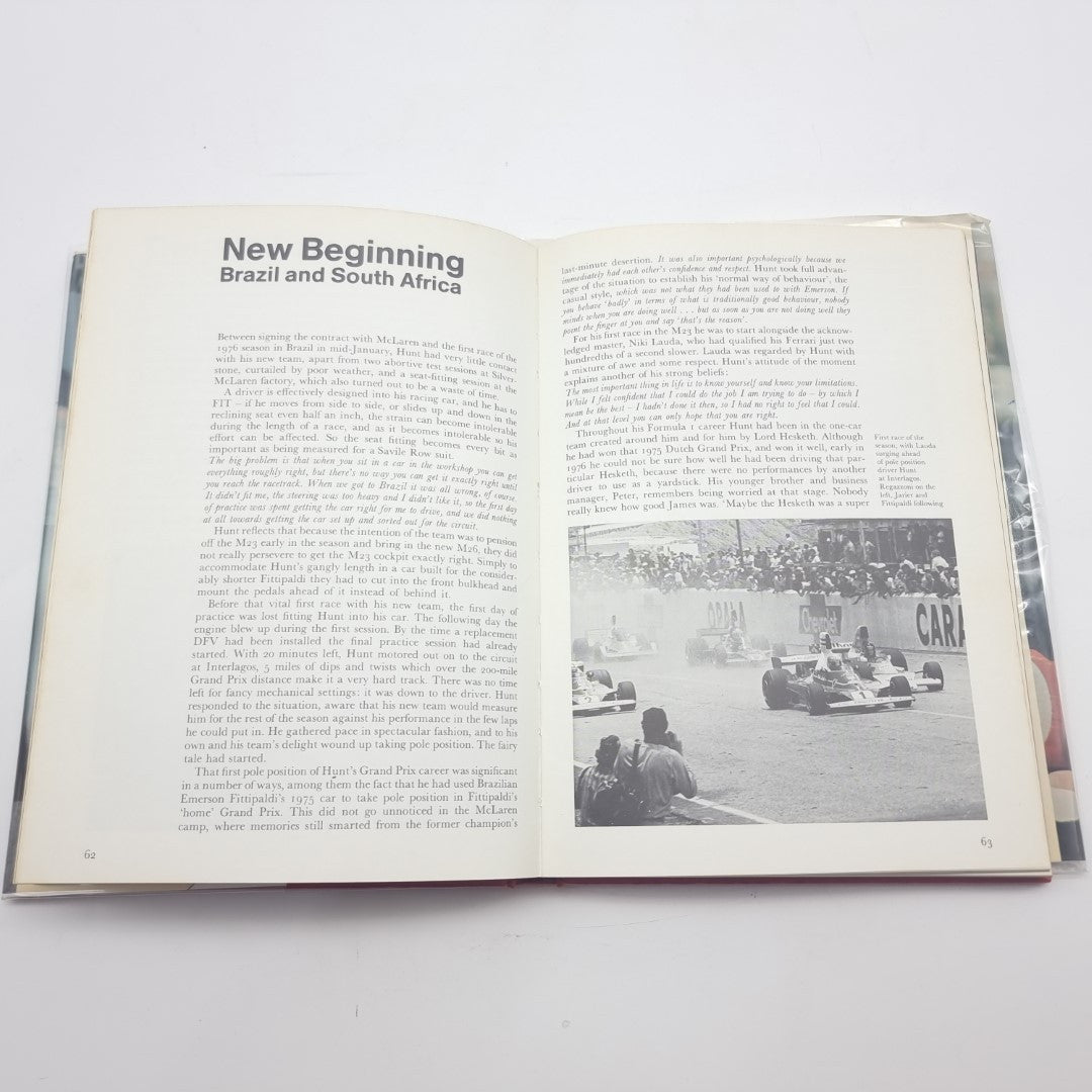 Signed racing memoir book, open spread with heading and black-and-white race photo