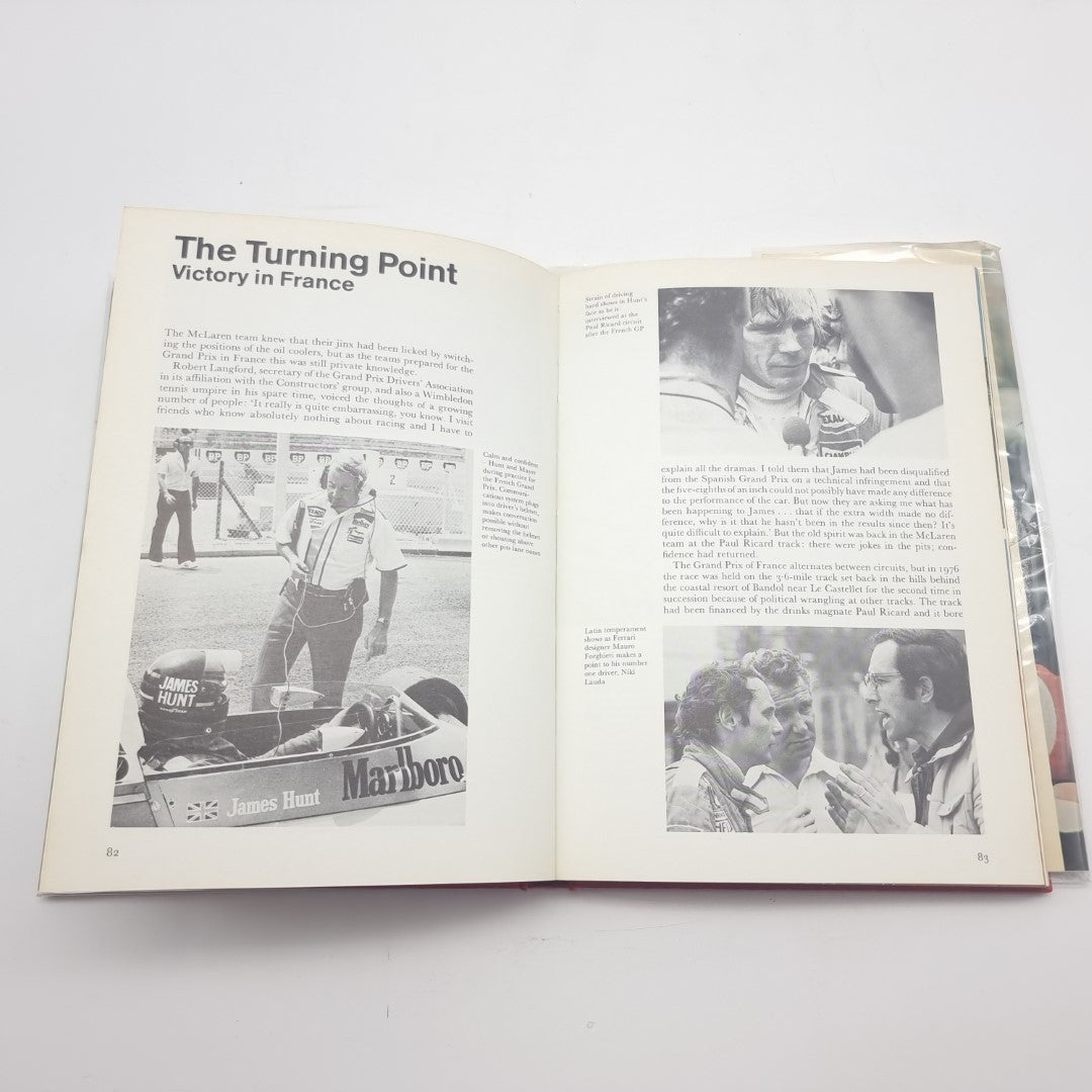 Racing memoir book open to an article titled "The Turning Point" with photos