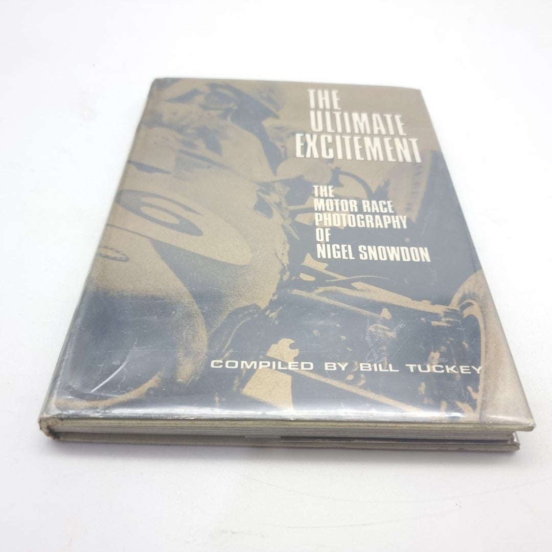 Motor race photography book on its side with front cover text: The Ultimate Excitement.