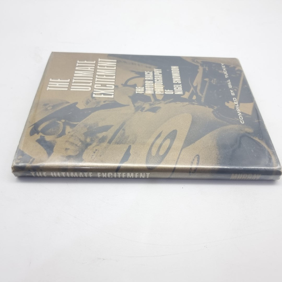Motor race photography book with spine and cover showing racing artwork and title lettering.