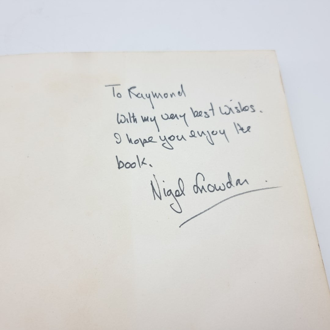 Signed note inside the motor race photography book with a dedication and signature.