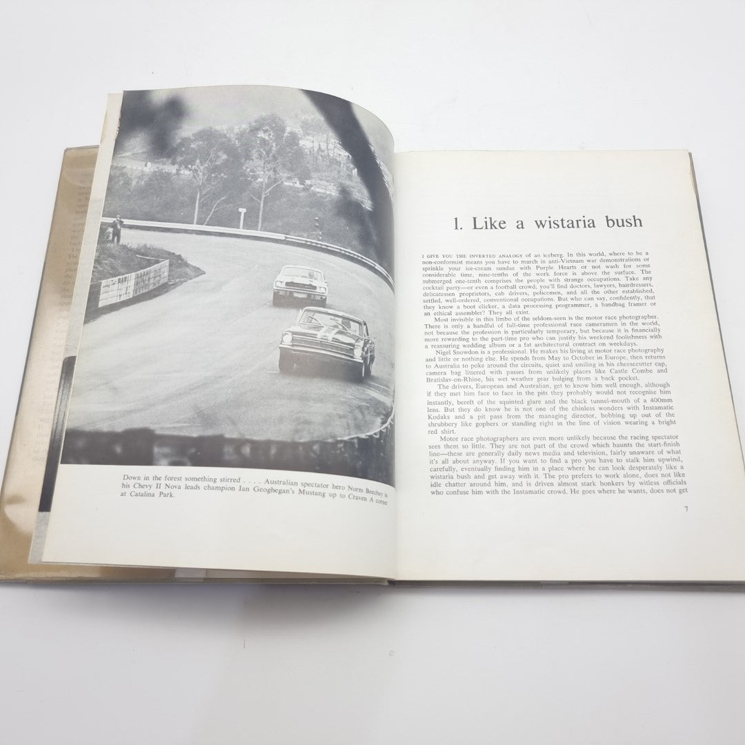 Motor race photography book opened to a story page titled 'Like a wisteria bush'.