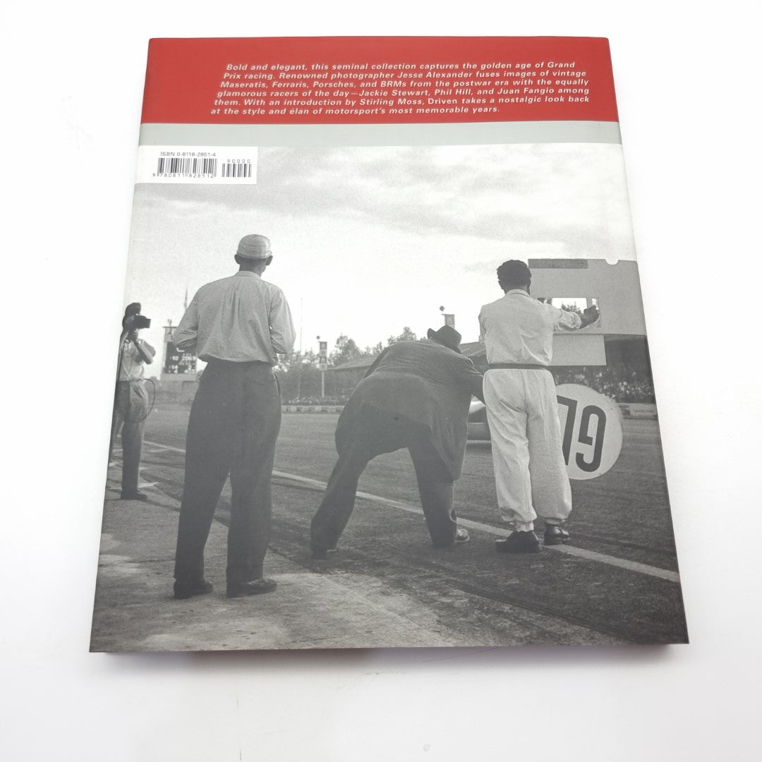 Racing photography book back cover with black-and-white track crew and cars