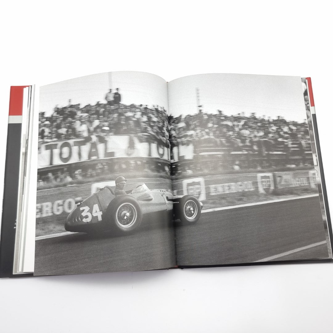 Racing photography book open spread with classic race cars on track