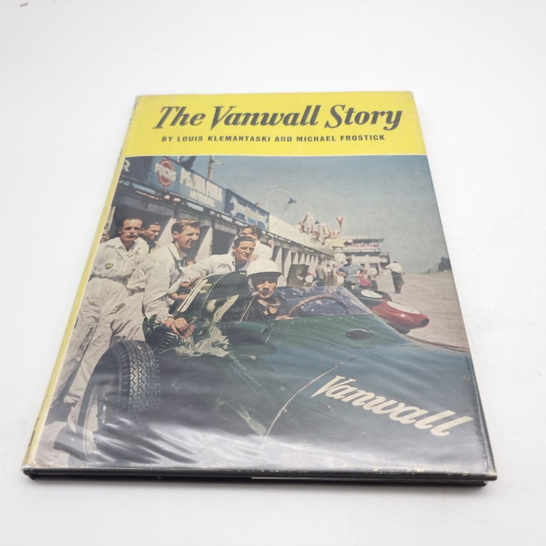 Vintage book cover with yellow and blue title panel and racing car photo