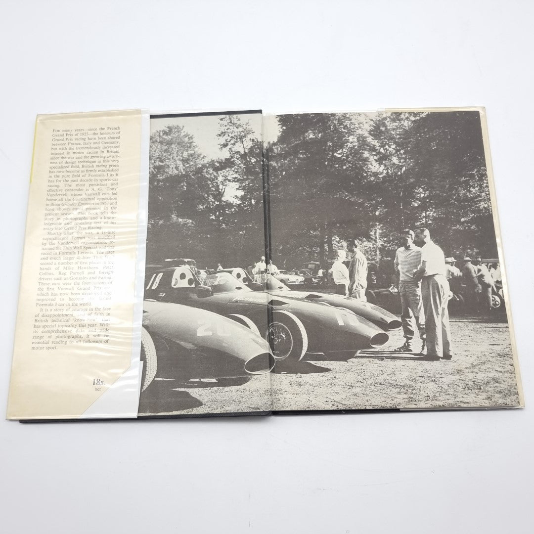 Vintage automotive book open to black-and-white racing car photo spread