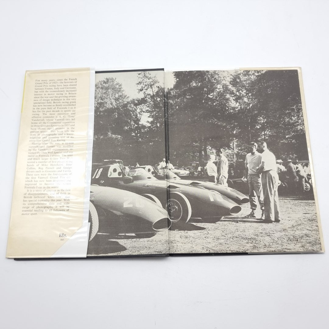Vintage automotive book open to black-and-white race car photo and captions