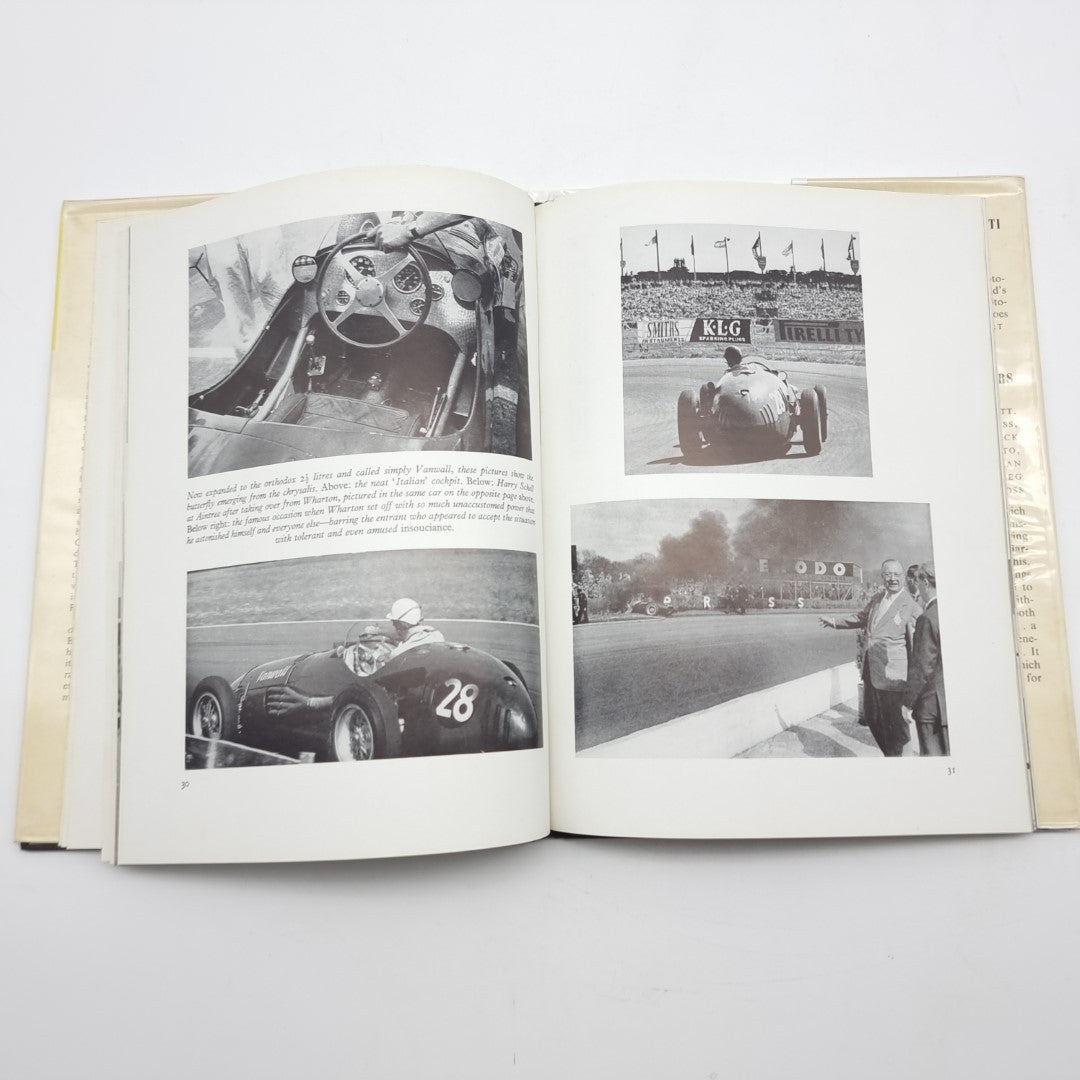 Vintage automotive book open to black-and-white car and track photo pages