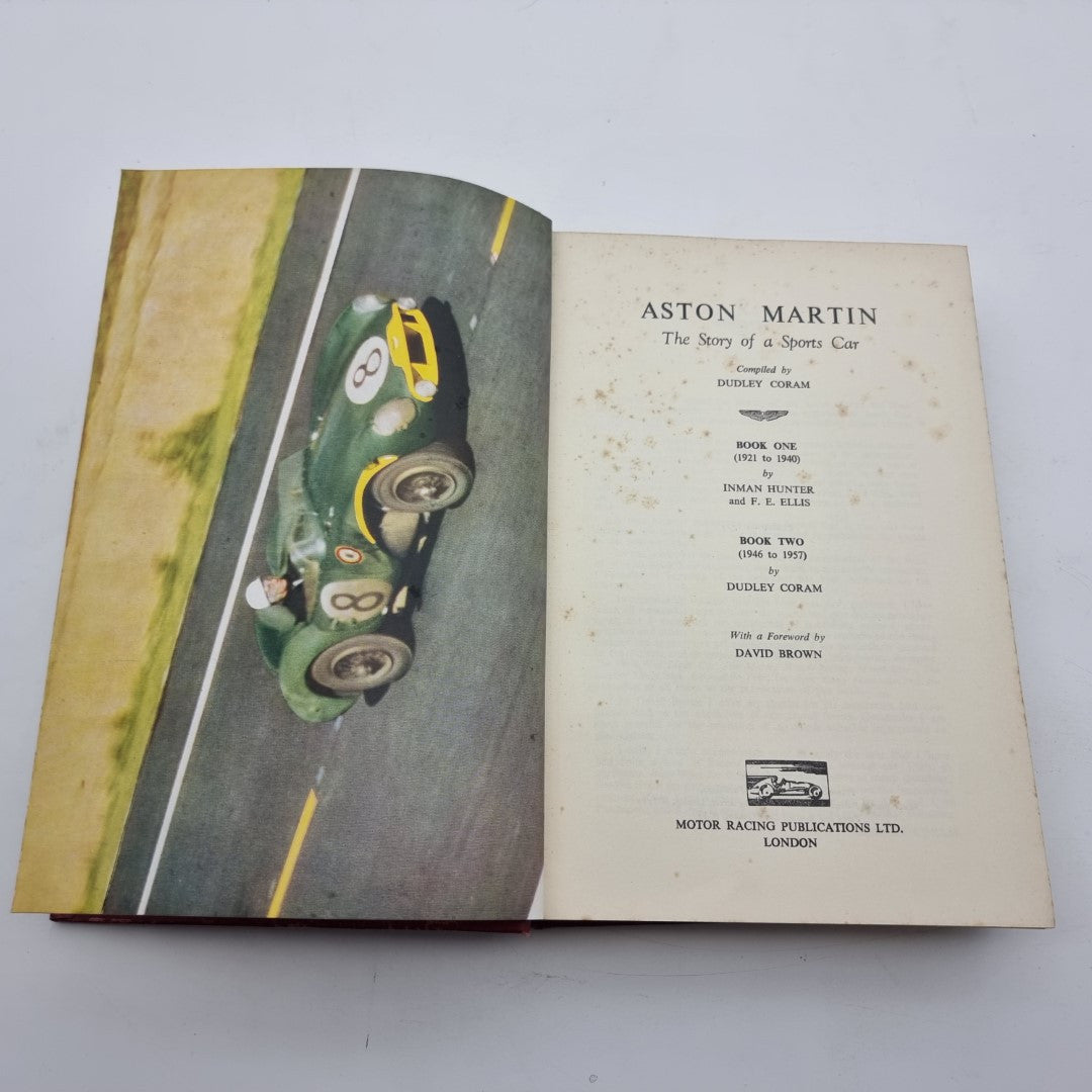 Open Aston Martin book showing photo spread and title page