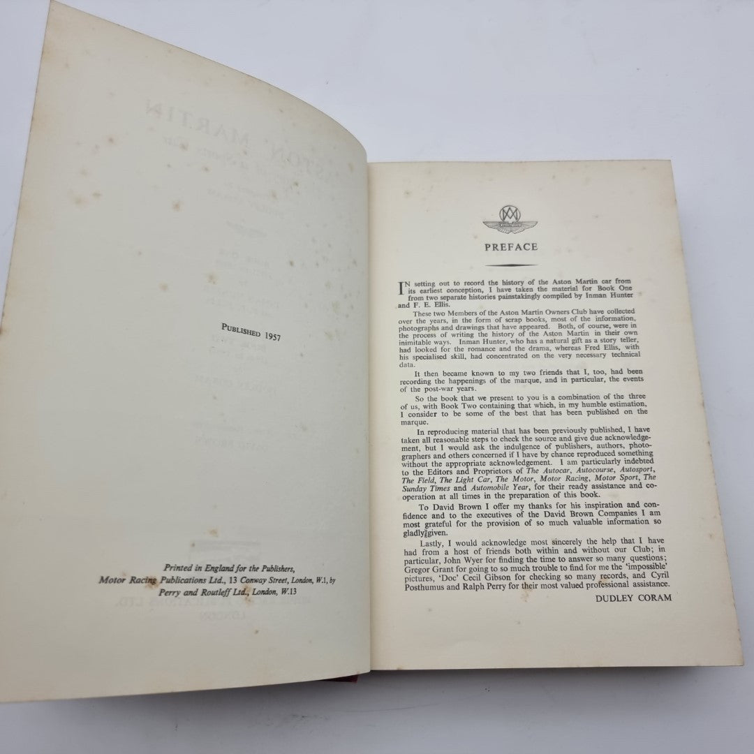 Open Aston Martin book showing preface page with dense printed text