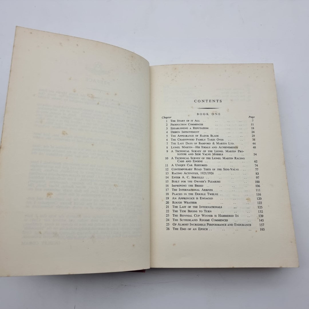 Open Aston Martin book showing contents page with chapter listings