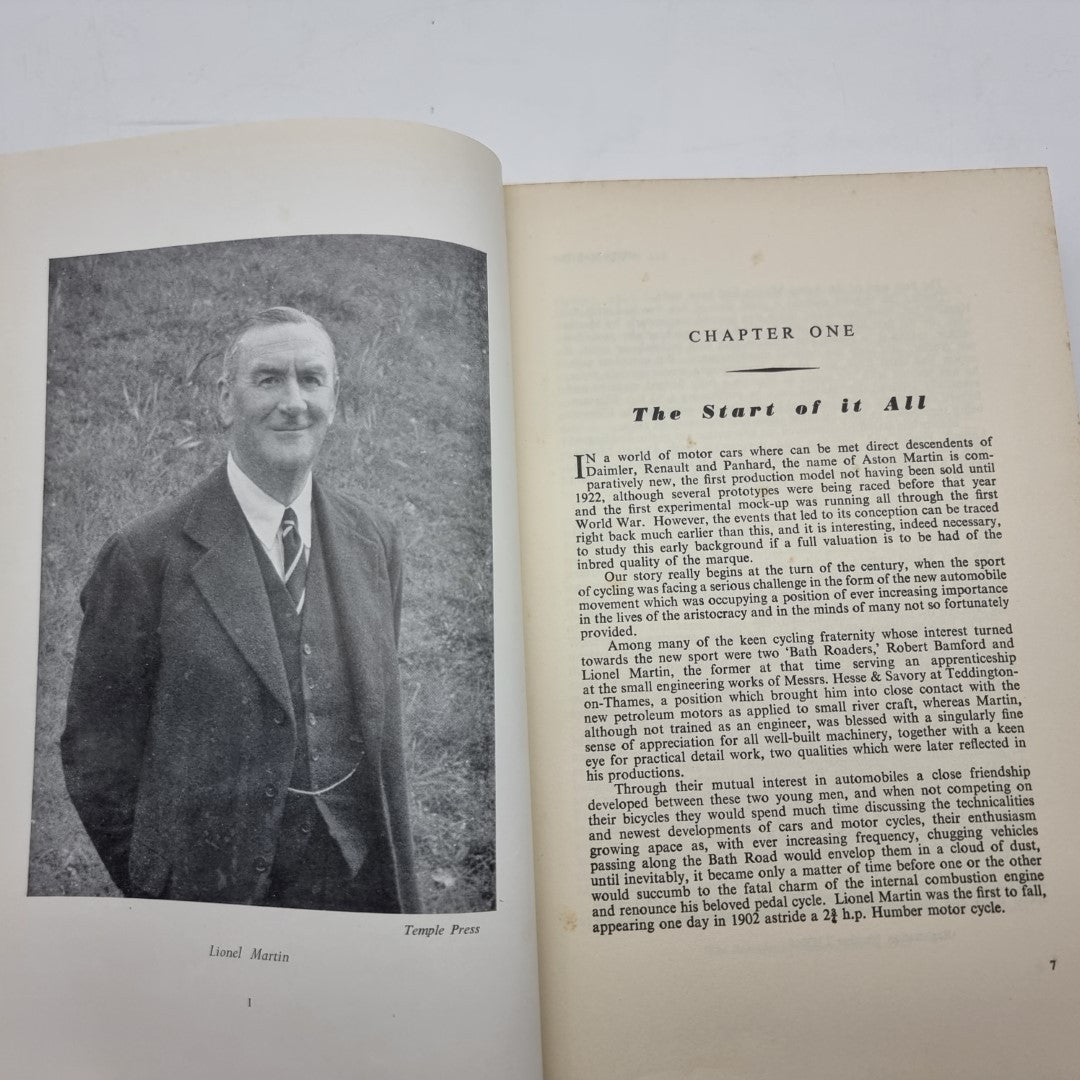 Open vintage book with portrait photo and chapter text on cream pages