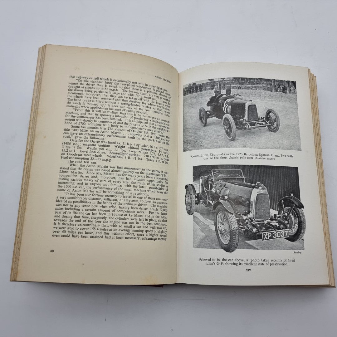 Open vintage book spread with two black-and-white car photos and text