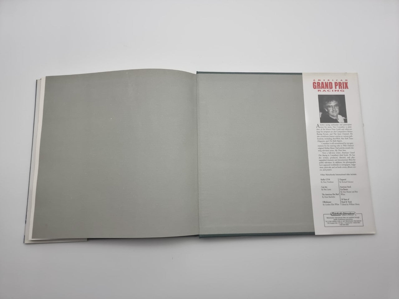 Open book with blank spread and a printed page insert on the right