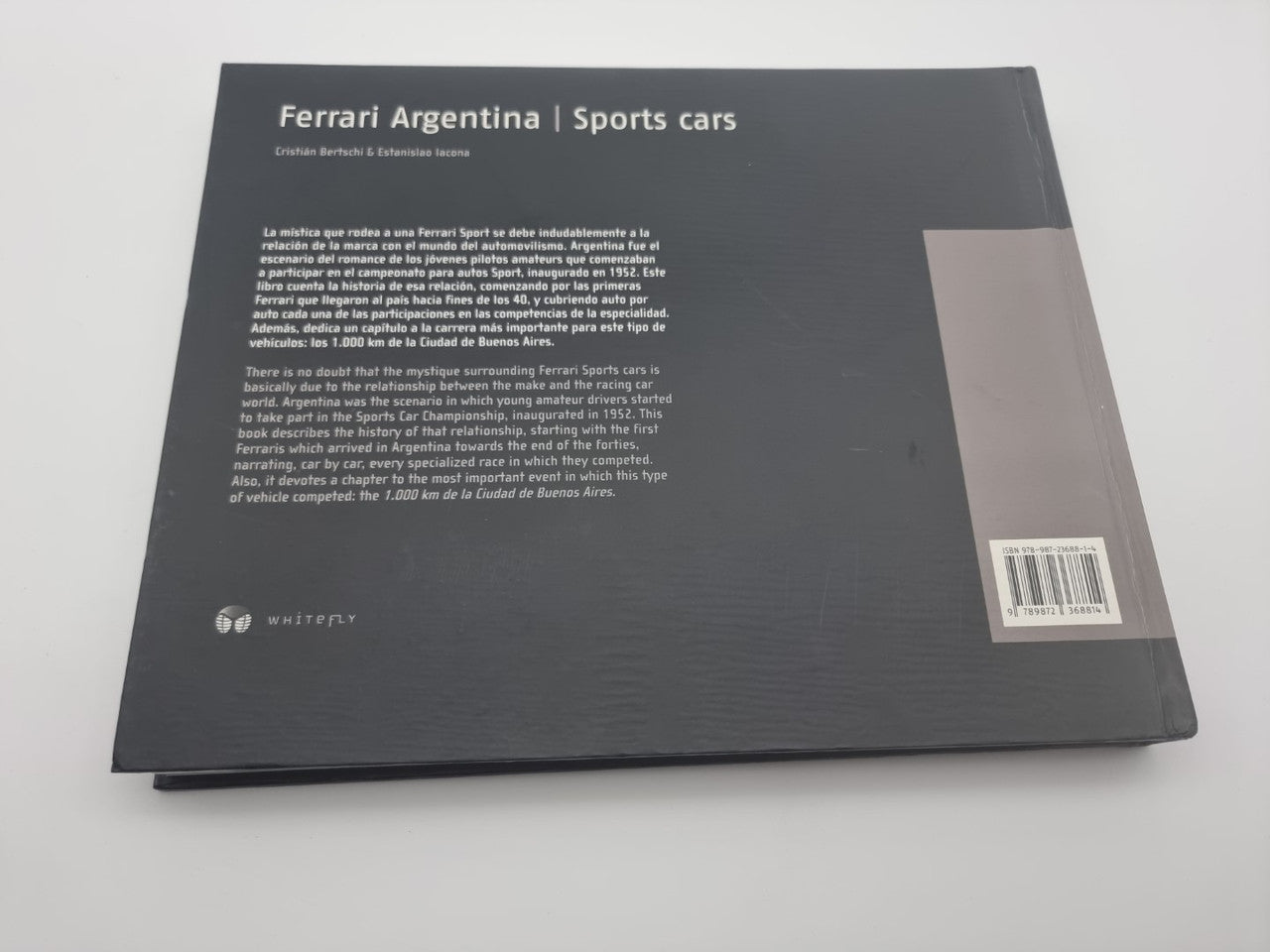 Black back cover of sports car book with printed description and barcode