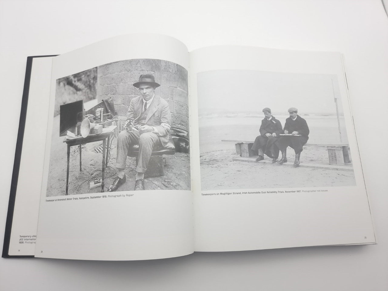 Open motor racing photo book showing two black-and-white race photos