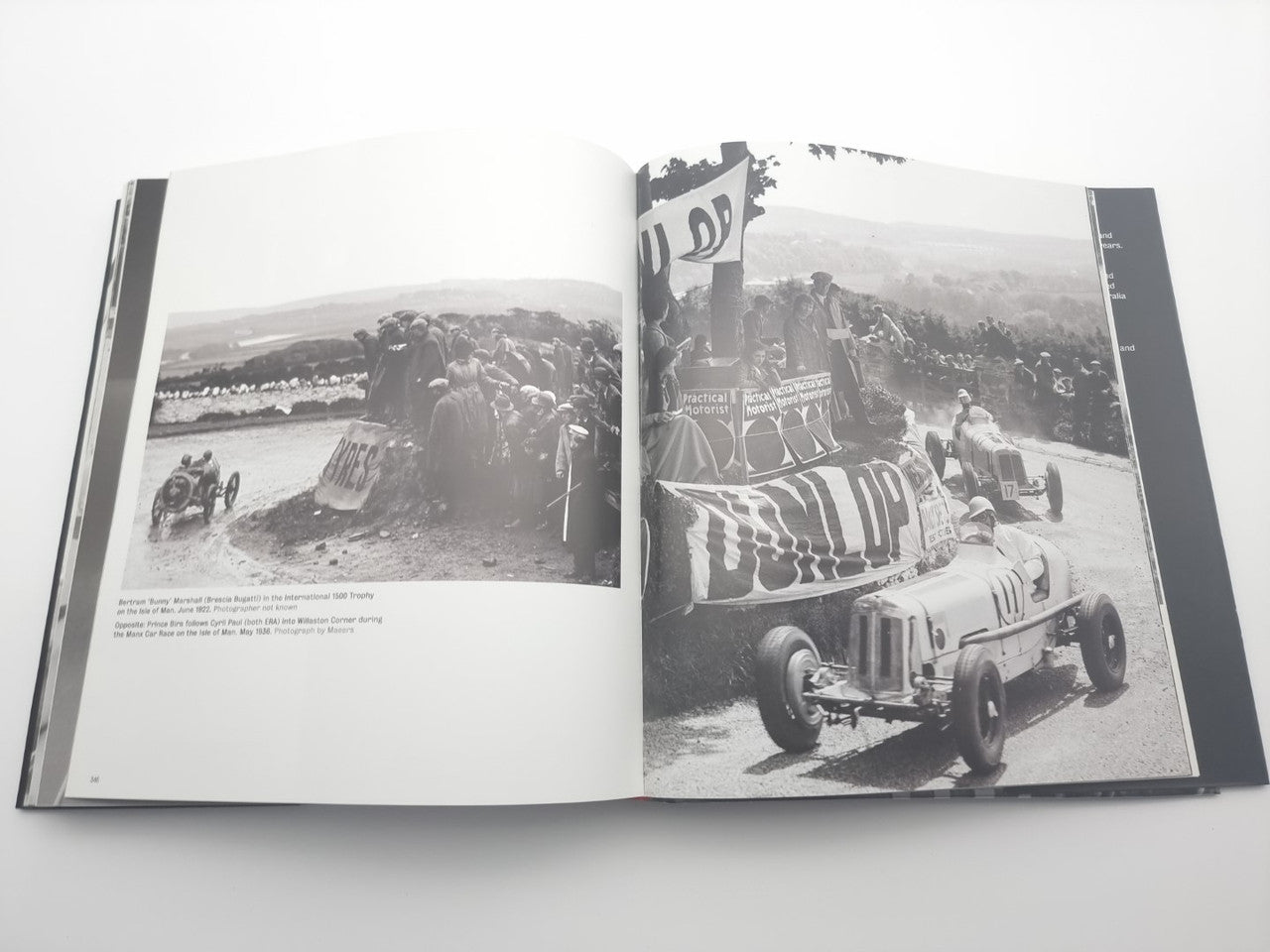Open motor racing photo book with two racing tracks and vintage cars
