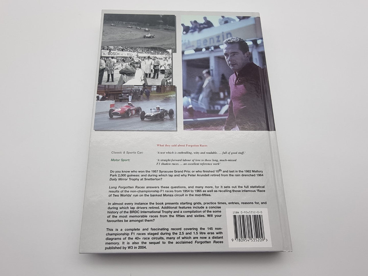Motorsport racing history book back cover with stacked race photos and barcode