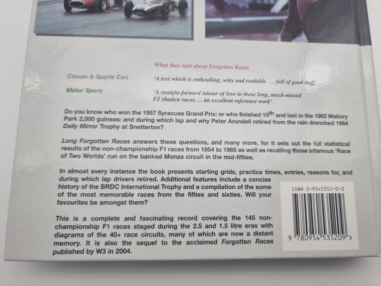 Back cover of a motorsport racing history book with summary text and barcode