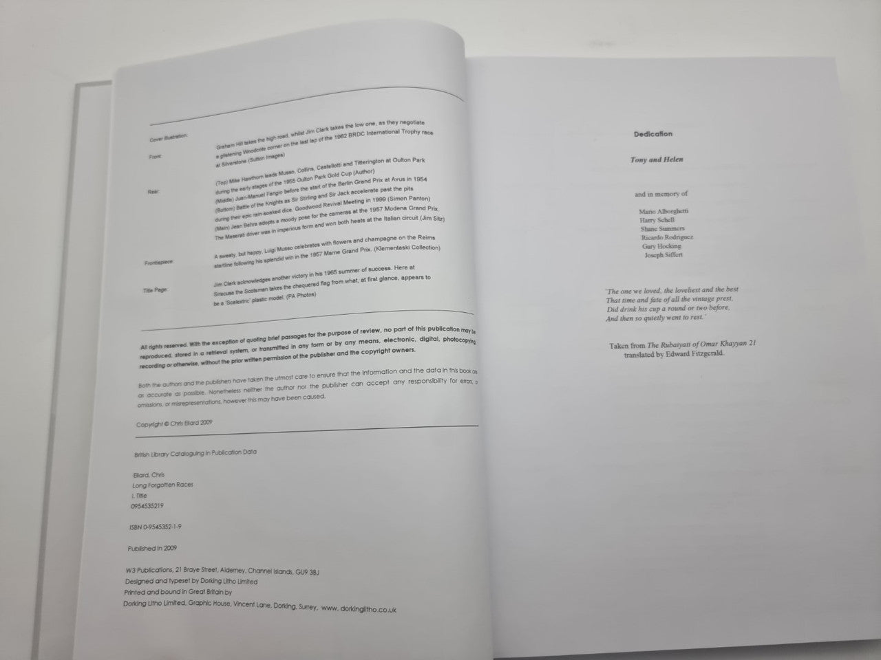 Open motorsport racing history book showing printed chapter text on both pages