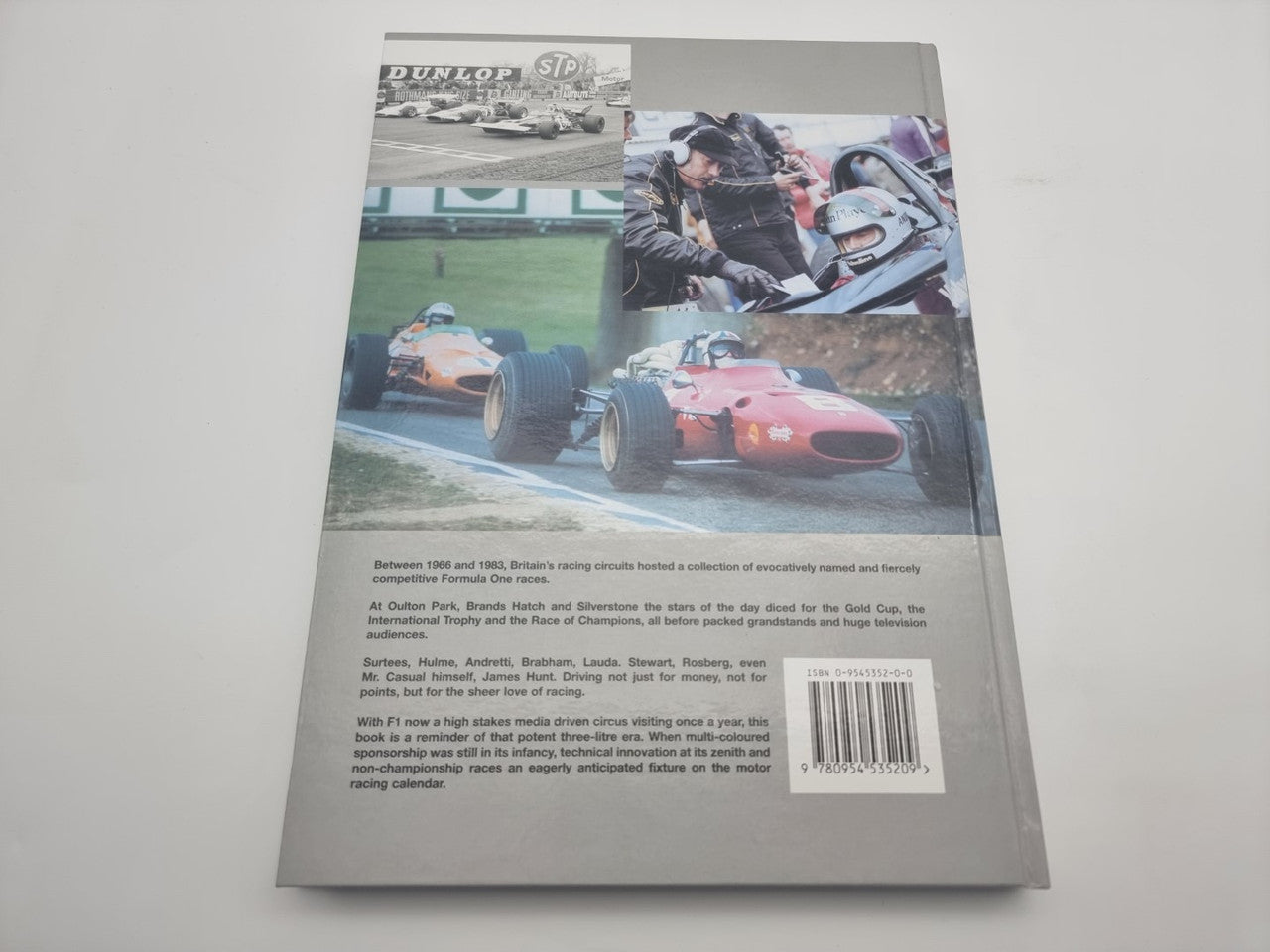 Race history book back cover with racing car photo collage and barcode